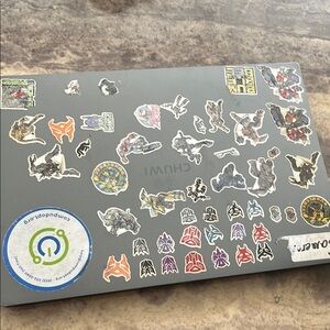 Gray Laptop with Stickers
